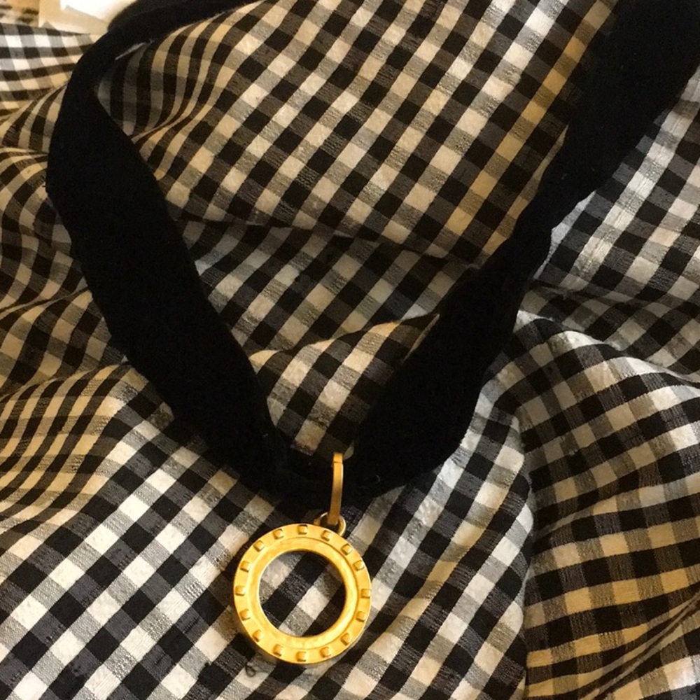 Gold circle on velvet ribbon